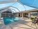 Enjoy the private screened pool and outdoor living area at 18053 Cullman Ave, Port Charlotte, FL 33948