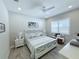 Bedroom with white furniture, shutters on the window, and light colored walls at 19836 Bridgetown Loop, Venice, FL 34293