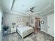 Spacious main bedroom with a trey ceiling and neutral decor offers a peaceful retreat at 19836 Bridgetown Loop, Venice, FL 34293