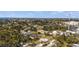 Wide aerial view of a neighborhood near the water showing many trees and homes at 200 Pameto Rd, Nokomis, FL 34275