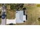 Aerial view of a home's roof and surrounding yard with a small trailer at 200 Pameto Rd, Nokomis, FL 34275