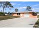 A single-story house with a well-kept front yard and a concrete driveway at 200 Pameto Rd, Nokomis, FL 34275