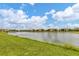 Scenic lake view showing multiple beautiful townhome residential buildings at 20390 Lagente Cir, Venice, FL 34293