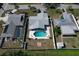 Aerial view of home featuring a private pool, patio, and fenced yard at 214 Lorraine Ave, Venice, FL 34293