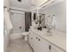 Bathroom featuring a vanity with sink, toilet, and shower with curtain rod at 214 Lorraine Ave, Venice, FL 34293