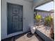 A beautiful front door entrance featuring a pot of plants and decorative tiling at 214 Lorraine Ave, Venice, FL 34293