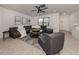 Bright living room featuring a modern sectional, stylish decor, and neutral tile flooring at 214 Lorraine Ave, Venice, FL 34293