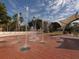 Interactive splash fountain set against a backdrop of swaying palms at 214 Lorraine Ave, Venice, FL 34293