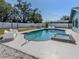 Covered patio with a ceiling fan, seating, and views of the backyard at 214 Lorraine Ave, Venice, FL 34293