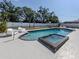 Backyard pool with a spa, lounge chairs, and a privacy fence at 214 Lorraine Ave, Venice, FL 34293