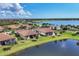 Aerial shot capturing the neighborhood's prime location by the lake at 24065 Canterwood Way, Venice, FL 34293