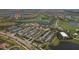 Aerial view of community center featuring a clubhouse, tennis courts, pool, and ample parking at 24065 Canterwood Way, Venice, FL 34293