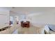 A dining room that shows the breakfast bar to the kitchen, table, and 6 chairs at 24065 Canterwood Way, Venice, FL 34293