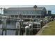 Community marina with boat docks and a large building, perfect for boaters and water enthusiasts at 242 Blackburn Blvd, North Port, FL 34287