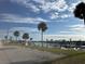 Scenic waterfront view showcasing palm trees, a calm waterway, and the community's proximity to the water at 242 Blackburn Blvd, North Port, FL 34287