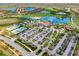 Panoramic aerial view of the community showcasing golf course, lakes, and residential areas at 24229 Spartina Dr, Venice, FL 34293