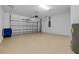 Spacious garage features an automatic garage door and water heater at 24229 Spartina Dr, Venice, FL 34293