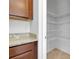 A convenient pantry features shelving that provides ample storage space at 24229 Spartina Dr, Venice, FL 34293