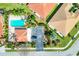 Aerial view of community pool, landscaping, and building exteriors at 27231 Ipswich Dr, Englewood, FL 34223