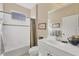 Bathroom with tub, shower, and updated vanity at 27231 Ipswich Dr, Englewood, FL 34223