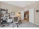 Home office features built-in shelving and a view into the kitchen at 27231 Ipswich Dr, Englewood, FL 34223