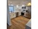 Modern kitchen featuring stainless steel appliances, white cabinets, and quartz countertops at 3014 W Southern Pkwy, Bradenton, FL 34205