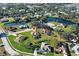 Beautiful aerial view of the home nestled in a serene community with lush greenery and tranquil ponds at 302 Woodingham Ct, Venice, FL 34292