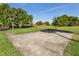 Outdoor basketball court in a grassy area, perfect for recreational games and enjoying the fresh air at 3020 Sail Pointe Cir # 5A, Venice, FL 34293