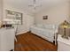 Cozy bedroom with wood floors, closet, and plenty of light from the window at 3020 Sail Pointe Cir # 5A, Venice, FL 34293