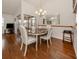 Bright dining area with hardwood floors, modern lighting, and access to lanai through sliding glass doors at 3020 Sail Pointe Cir # 5A, Venice, FL 34293