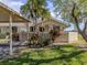 Charming home exterior featuring a carport, manicured lawn, and tropical landscaping at 3020 Sail Pointe Cir # 5A, Venice, FL 34293