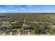 Aerial view of a residential neighborhood with well-maintained properties and mature trees at 3415 N Cranberry Blvd, North Port, FL 34286