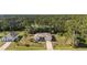 Aerial view of a beautiful home surrounded by trees at 3415 N Cranberry Blvd, North Port, FL 34286