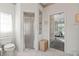 Bright bathroom with a glass shower, a toilet, and access to the main bedroom at 3415 N Cranberry Blvd, North Port, FL 34286