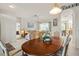 View of dining room flowing into living room, with adjacent furniture at 3415 N Cranberry Blvd, North Port, FL 34286