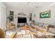 Well-lit living room with floral seating and a large entertainment center at 3415 N Cranberry Blvd, North Port, FL 34286