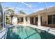 Sparkling pool with screened-in enclosure and sunny patio at 3415 N Cranberry Blvd, North Port, FL 34286