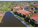 Aerial view of condos near a pond and golf course community at 3500 El Conquistador Pkwy # 333, Bradenton, FL 34210