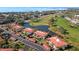 An aerial view of the condos near the golf course and pond at 3500 El Conquistador Pkwy # 333, Bradenton, FL 34210