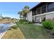 Water view exterior with a grassy lawn and private lanai of this two-story home, perfect for enjoying the outdoors at 3500 El Conquistador Pkwy # 333, Bradenton, FL 34210