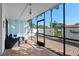 Inviting patio with tile flooring, a seating area, and a view of a lush landscape through the screened enclosure at 3500 El Conquistador Pkwy # 333, Bradenton, FL 34210