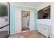 Mud room featuring laundry closet with washer and dryer, plus storage cabinet; all adorned with coastal style at 3500 El Conquistador Pkwy # 333, Bradenton, FL 34210