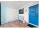 Coastal themed mud room featuring bright blue trim, white closet doors, and stylish decor, plus tile flooring at 3500 El Conquistador Pkwy # 333, Bradenton, FL 34210