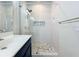 Beautiful bathroom with a modern glass shower and mosaic tile flooring at 3730 82Nd Avenue E Cir # 104, Sarasota, FL 34243