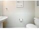 Half bathroom with pedestal sink and toilet at 3730 82Nd Avenue E Cir # 104, Sarasota, FL 34243