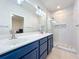 Stylish bathroom features a double sink vanity and large glass enclosed shower at 3730 82Nd Avenue E Cir # 104, Sarasota, FL 34243