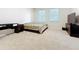 Spacious bedroom featuring two large windows and neutral carpeting at 3730 82Nd Avenue E Cir # 104, Sarasota, FL 34243