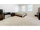 Bedroom featuring carpet floors, windows, a tv and desk at 3730 82Nd Avenue E Cir # 104, Sarasota, FL 34243