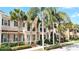 Inviting townhome showcasing a balcony, complemented by mature landscaping, and charming architectural details at 3730 82Nd Avenue E Cir # 104, Sarasota, FL 34243