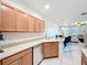 Kitchen area featuring stainless steel appliances and tile floors at 3730 82Nd Avenue E Cir # 104, Sarasota, FL 34243